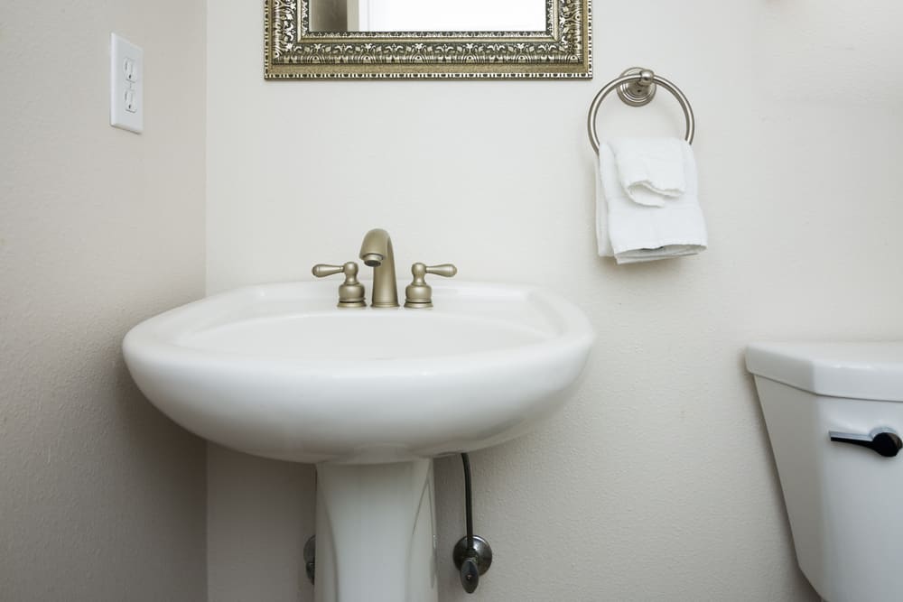 How to Attach a Pedestal Sink to The Wall